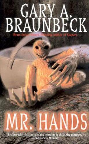 The cover of the Leisure edition of Mr. Hands by Gary A Braunbeck. A skull-faced doll with large hands is slumped against a white Mary Jane.